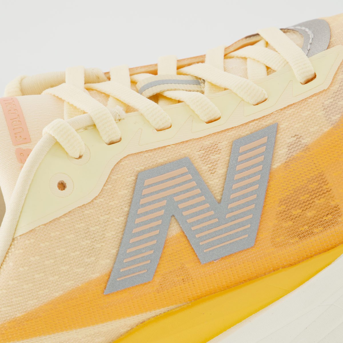 Tênis New Balance Fuelcell Rebel V5 Feminino Laranja e Branco Branco 7