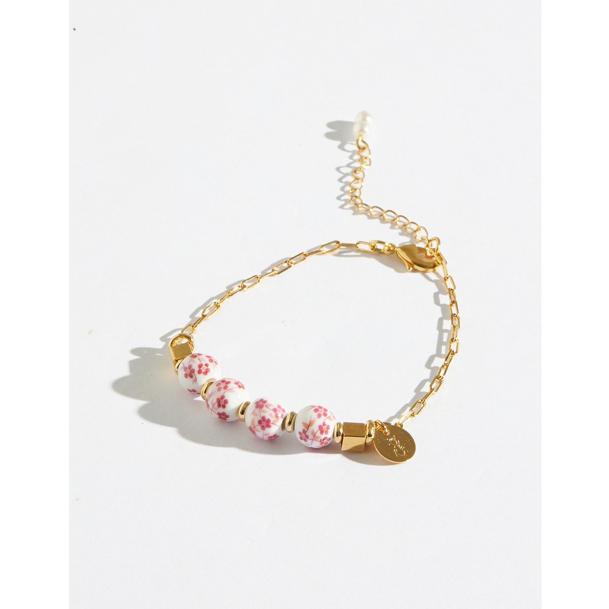Pulseira Rosas Cerâmica com Banho Dourado